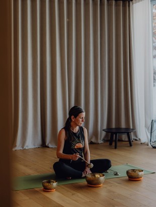 Yoga Instructor Sabrina During Singing Bowl Meditation at Naturresort Puradies Yoga instructor Sabrina during singing bowl meditation at Naturresort Puradies